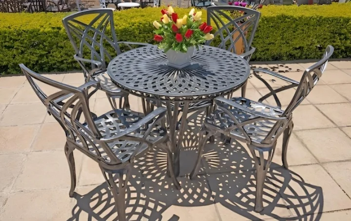 Rainbow - Four black chairs with armrests and a black round table